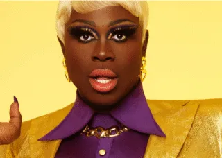 person in suit with yellow background
